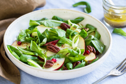 Mâche with Apple, Pomegranate and Pecan salad by vinaigrette